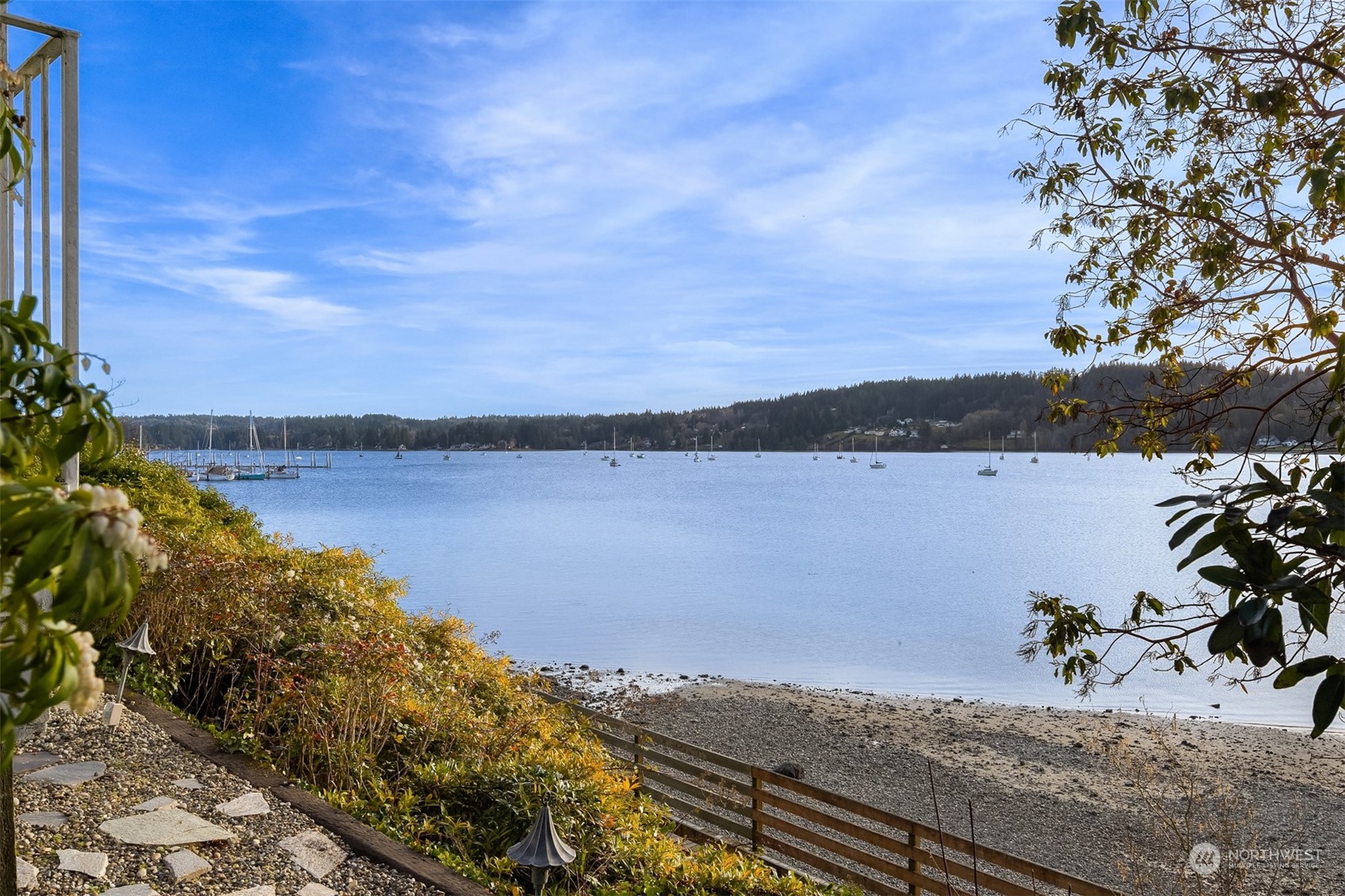 19083 Front Street Northeast, Unit 4 Poulsbo, WA 98370 - Photo 34 of 40 a view of a lake with houses in the back