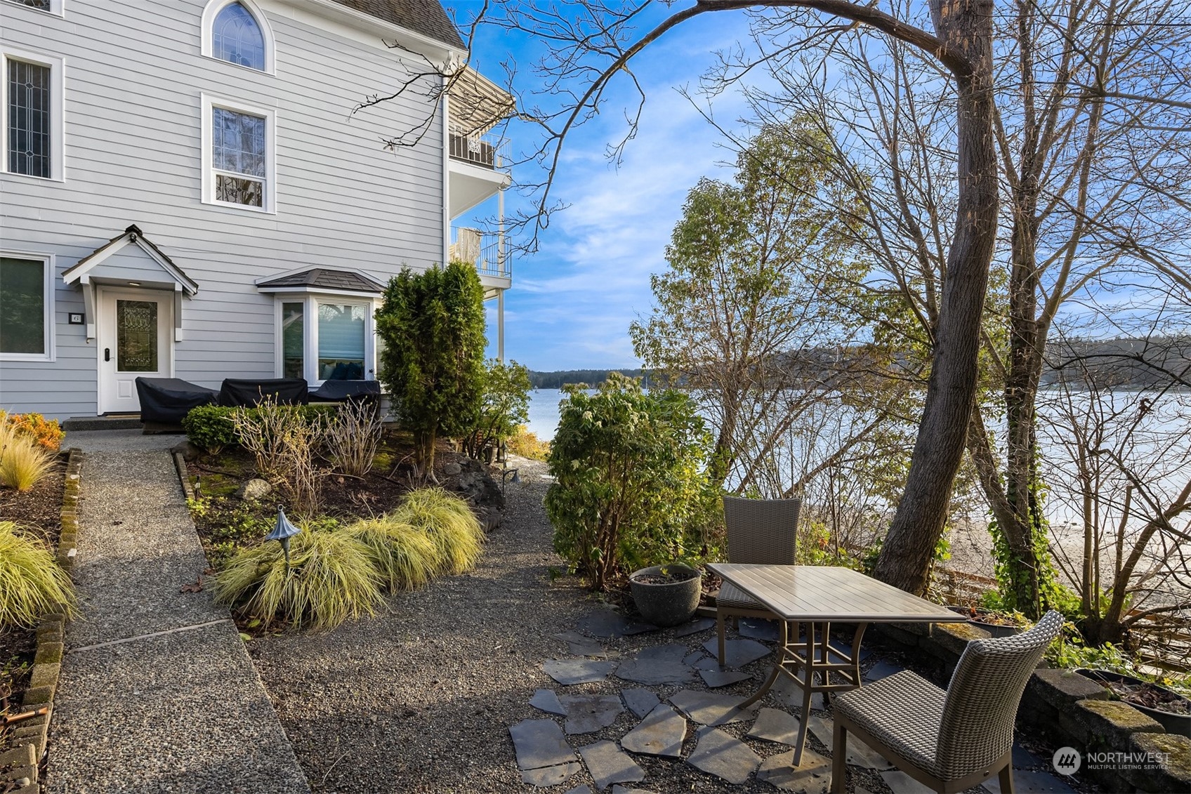 19083 Front Street Northeast, Unit 4 Poulsbo, WA 98370 - Photo 35 of 40 a view of backyard with outdoor seating and plants