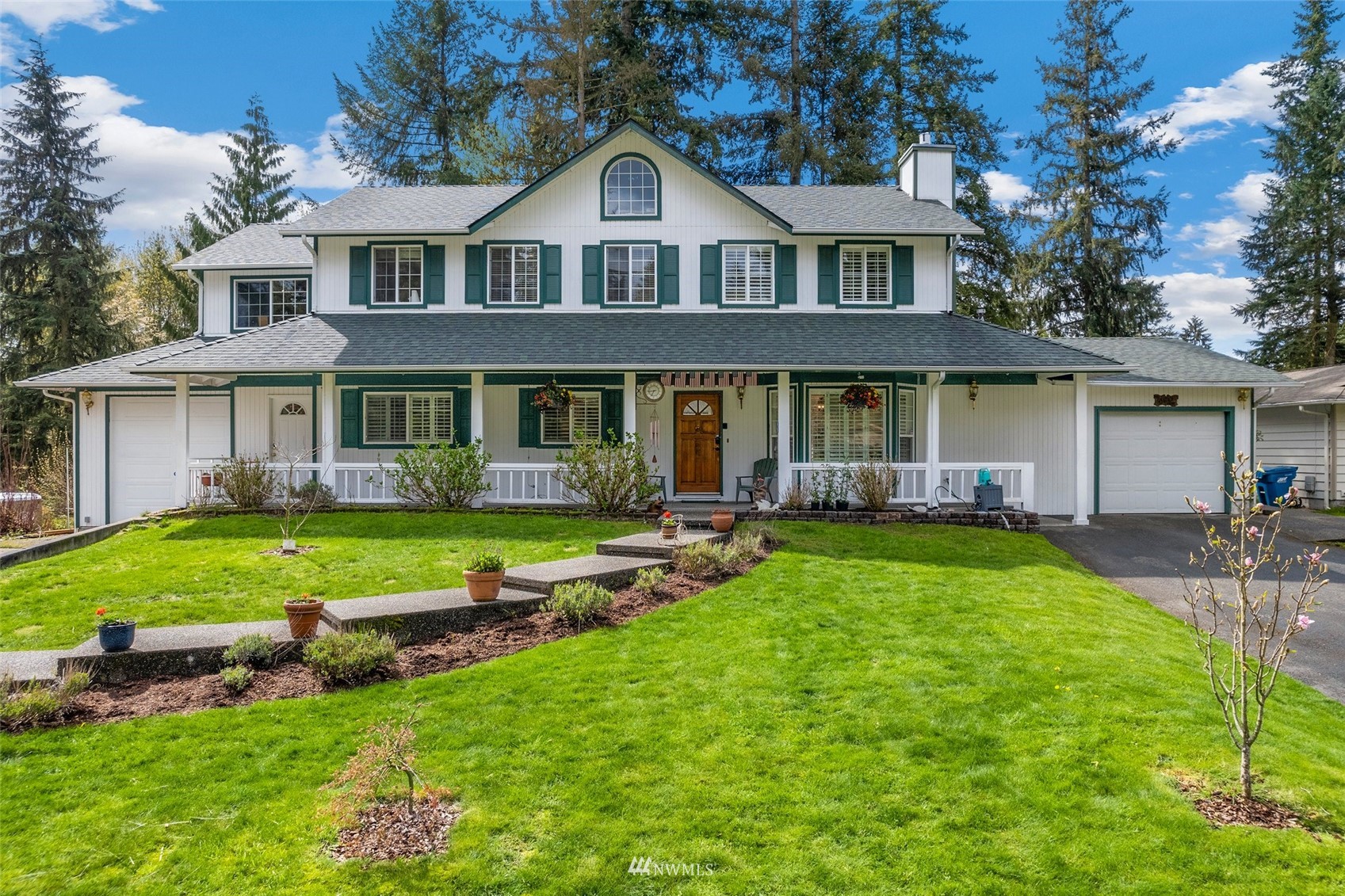 20605 Southeast 159th Street Renton, WA 98059 - Photo 1 of 40 a front view of a house with a yard table and chairs