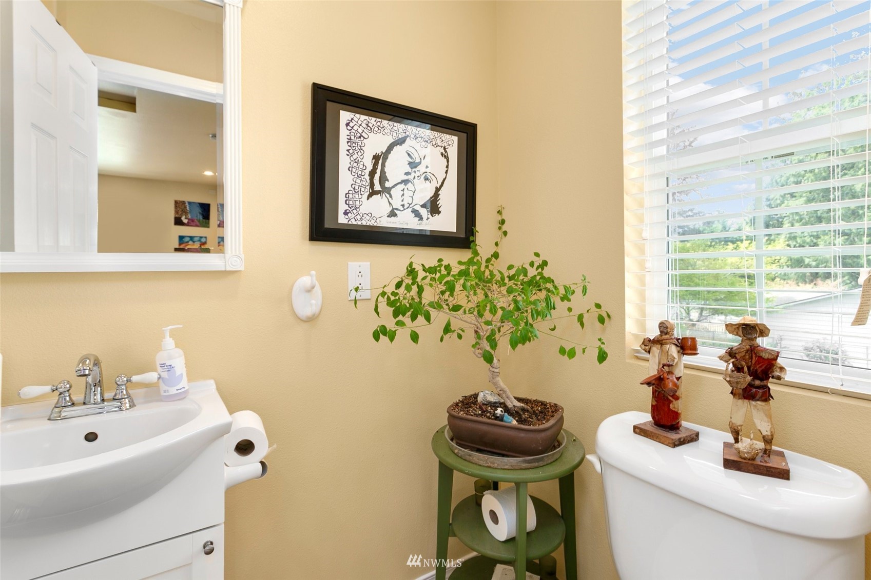 20605 Southeast 159th Street Renton, WA 98059 - Photo 29 of 40 a bathroom with a sink and a mirror