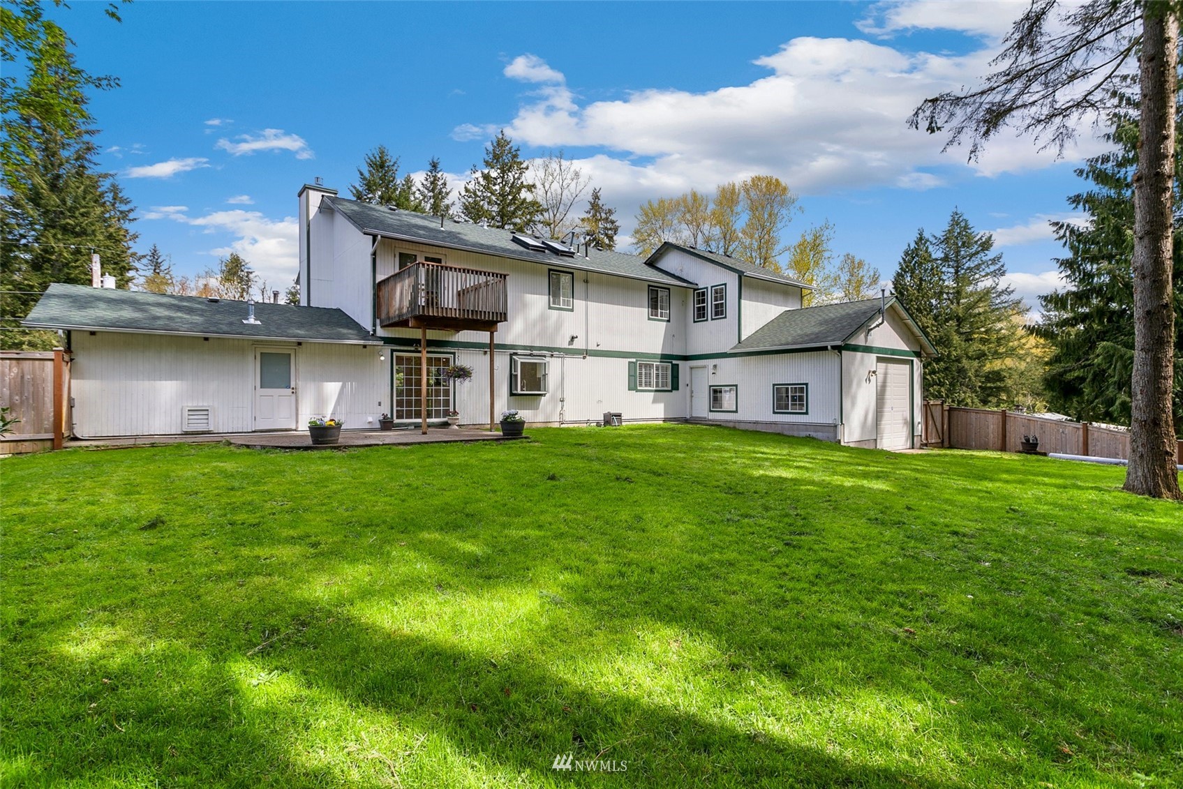 20605 Southeast 159th Street Renton, WA 98059 - Photo 33 of 40 a view of a house with a big yard and large trees