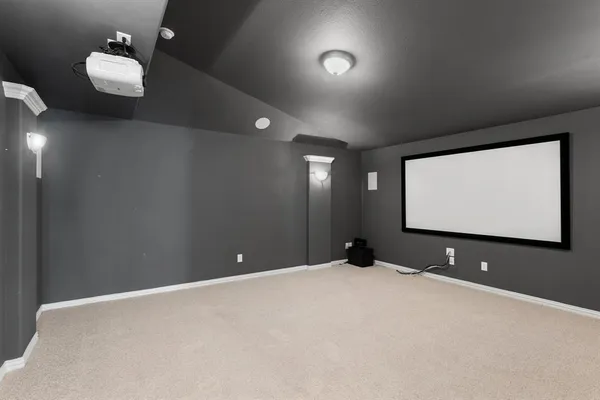 a view of a projector room with projector and screen