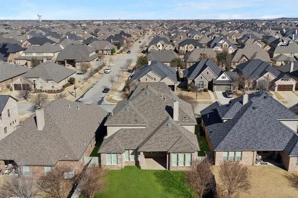 an aerial view of multiple houses with a outdoor space