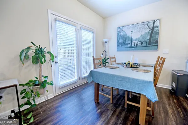 a view of a dining room with furniture window and wooden floor