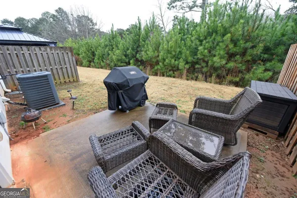a view of an outdoor sitting area with furniture