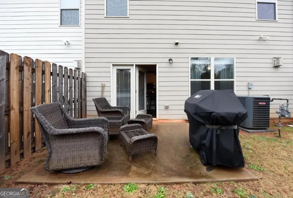 a view of a chairs and table in the patio