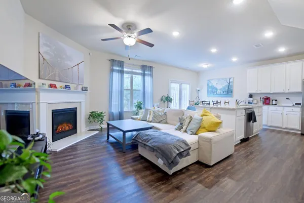 a living room with furniture fireplace and a fireplace