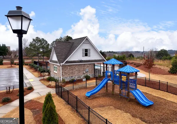 a view of a swimming pool with sitting area