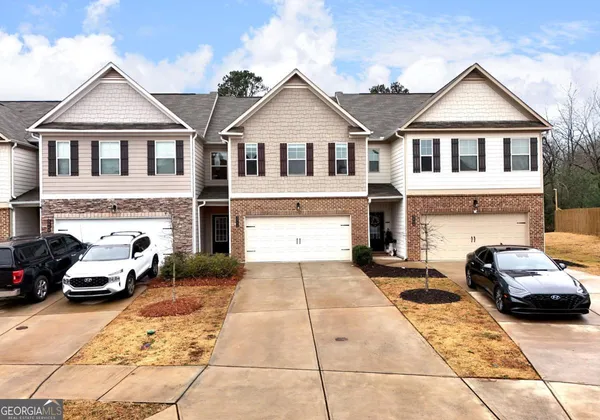 a view of a car parked in front of a house