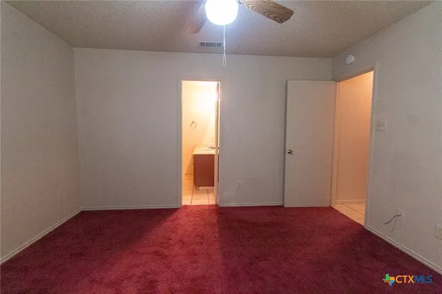 an empty room with a empty space and a window