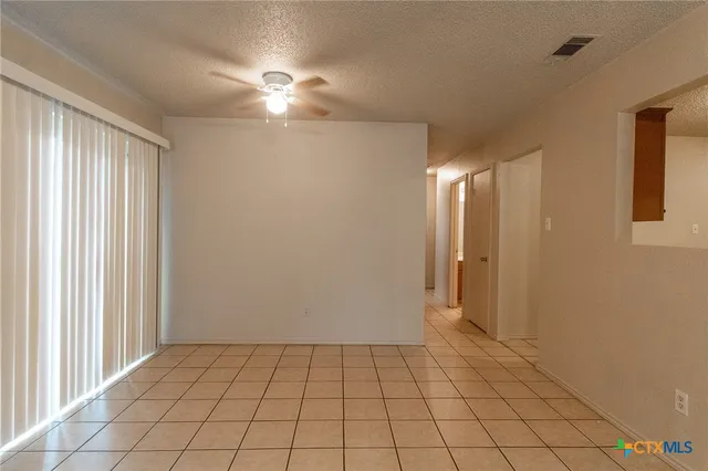 a view of an empty room and window