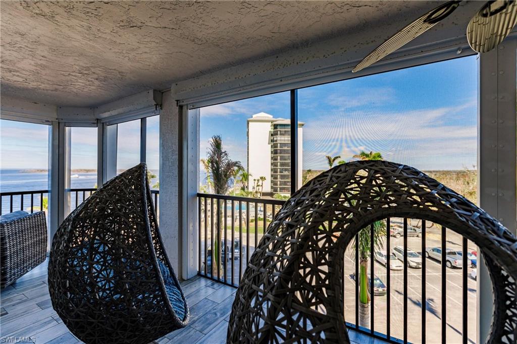 17170 Harbour Point Drive, Unit 437 Fort Myers, FL 33908 - Photo 37 of 41 Unfurnished sunroom with a water view