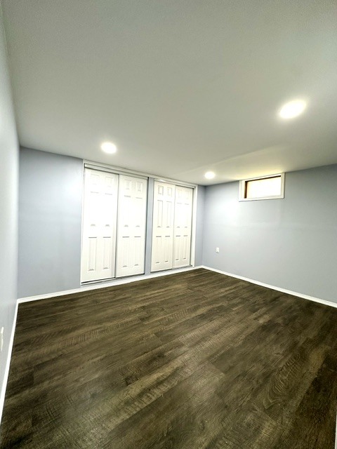 513 Cookane Avenue Elgin, IL 60120 - Photo 18 of 26 an empty room with wooden floor and windows