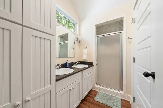 an aerial view of multiple houses with yard