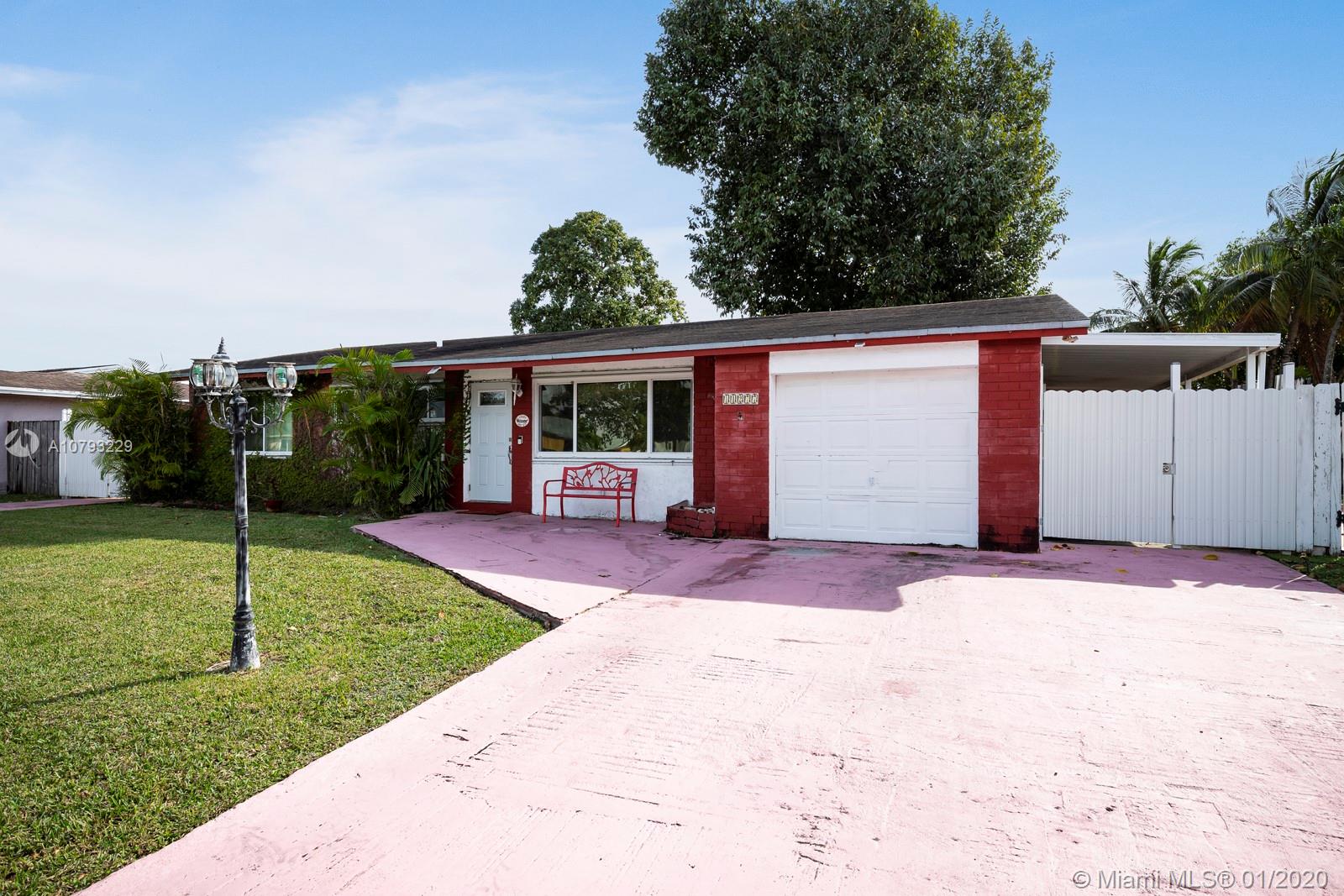 11277 Southwest 111th Court Road Miami, FL 33176 - Photo 2 of 13 Front exterior with ample parking space