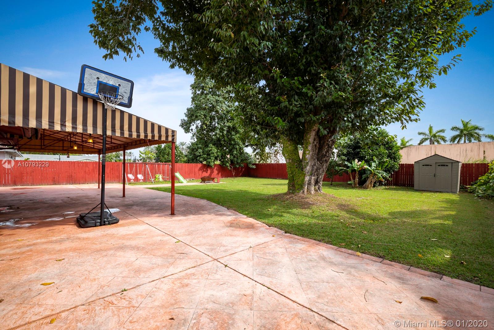 11277 Southwest 111th Court Road Miami, FL 33176 - Photo 11 of 13 Large covered patio and huge fenced back garden