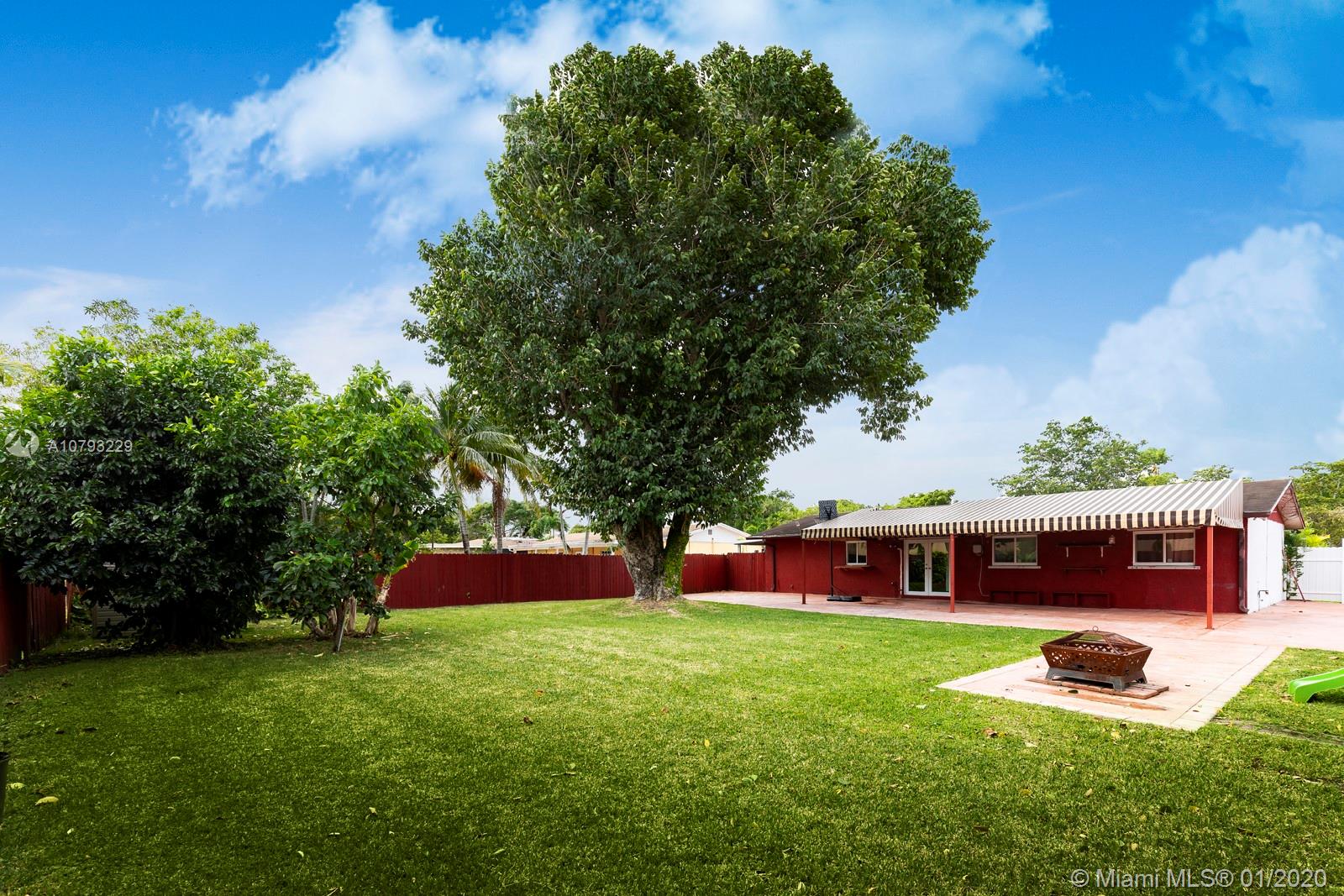 11277 Southwest 111th Court Road Miami, FL 33176 - Photo 12 of 13 Lush fenced garden with room for boat storage at right