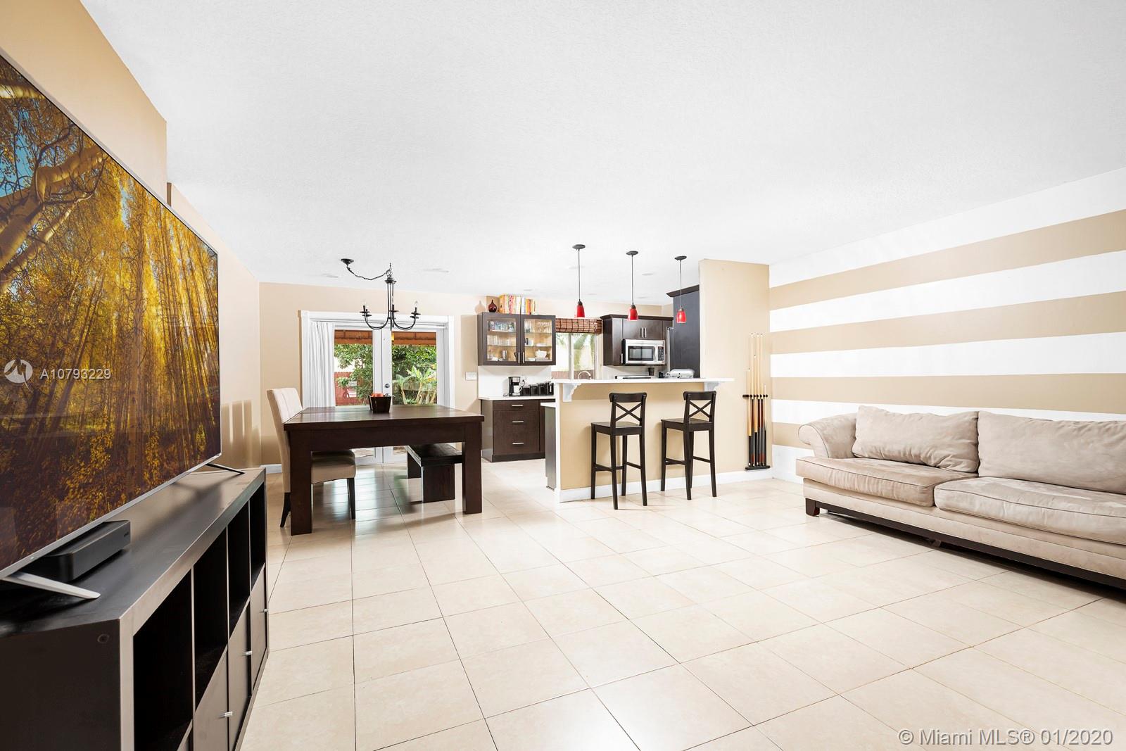 11277 Southwest 111th Court Road Miami, FL 33176 - Photo 4 of 13 Living room with view to dining and kitchen