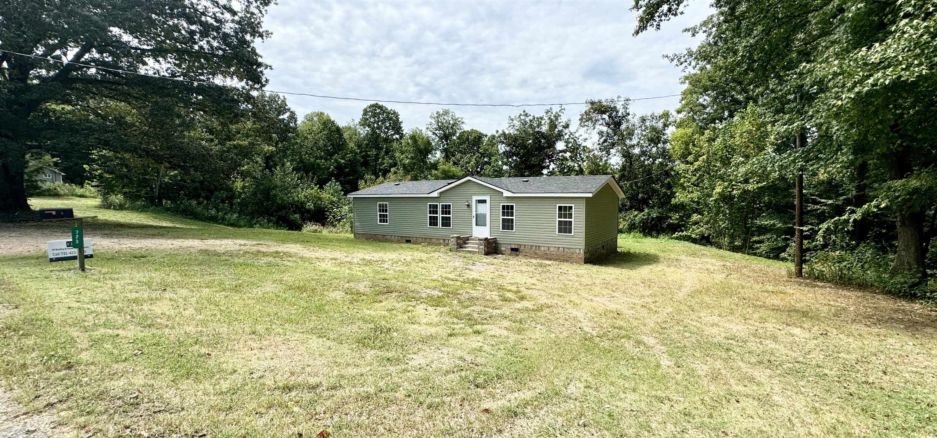 723 Patton Lane Ripley, TN 38063 - Photo 3 of 22 a front view of a house with a yard