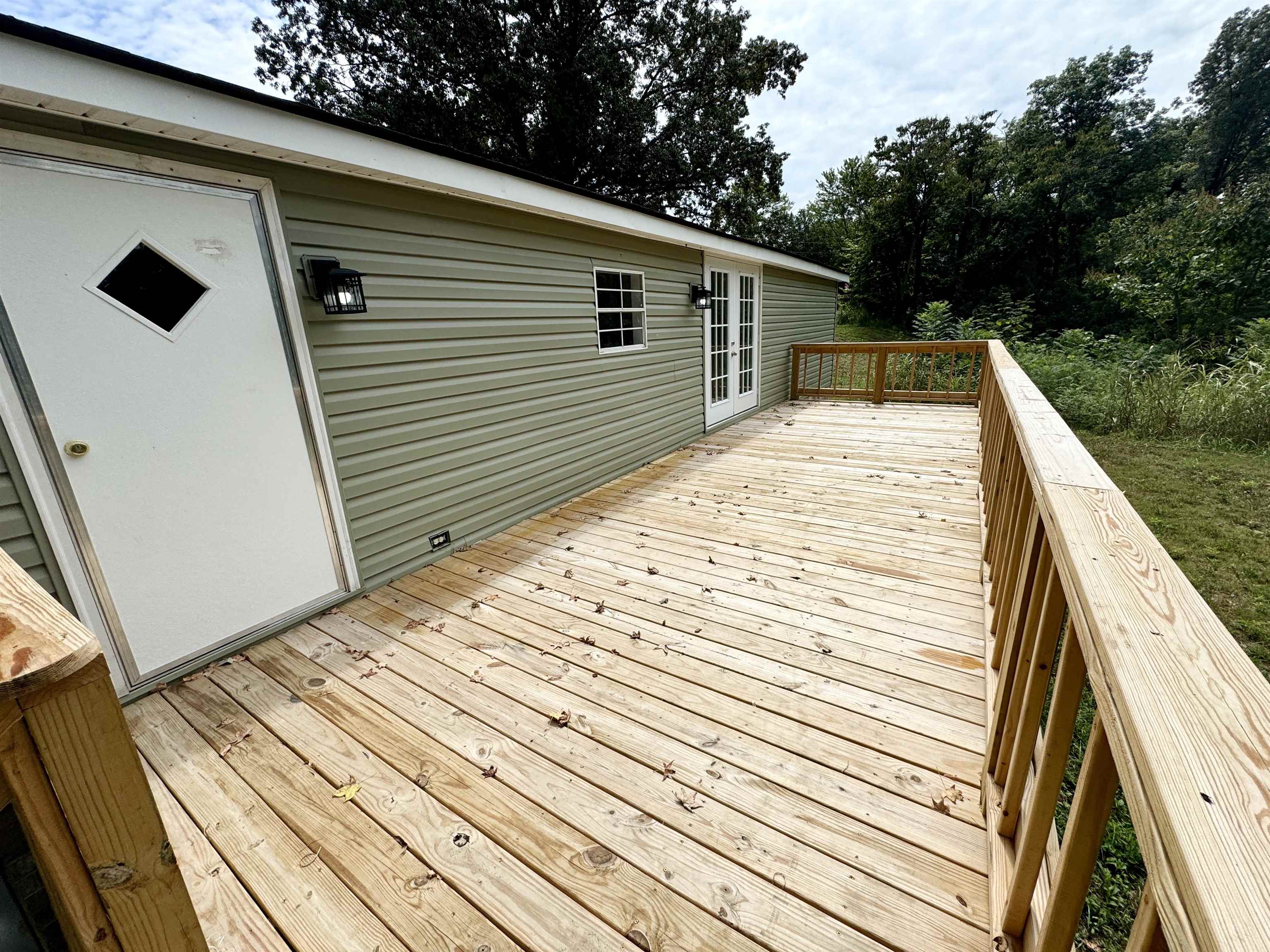 723 Patton Lane Ripley, TN 38063 - Photo 5 of 22 a view of a backyard with wooden floor
