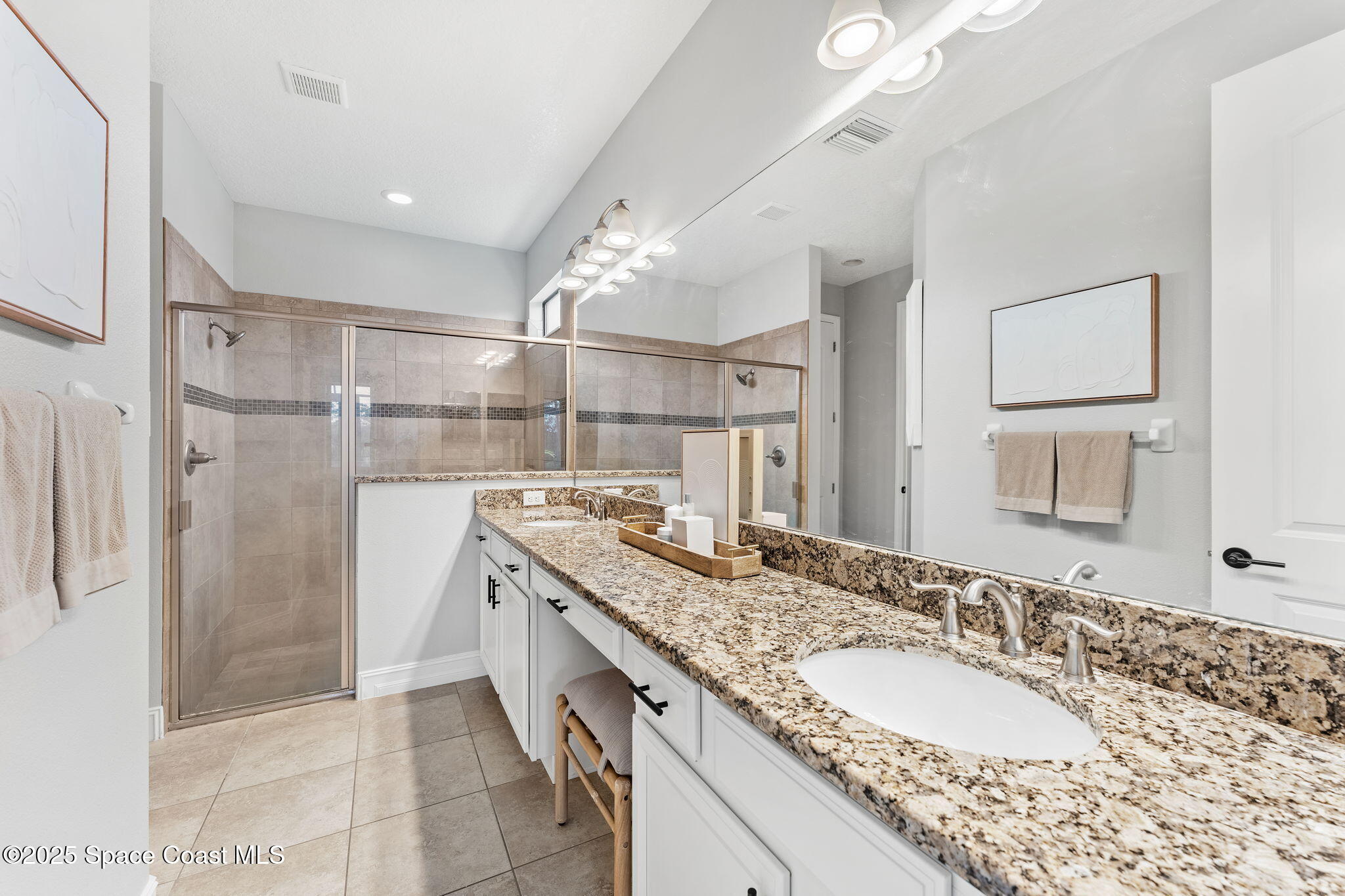 8545 Stalwart Circle Melbourne, FL 32940 - Photo 11 of 51 a bathroom with a granite countertop sink mirror and double
