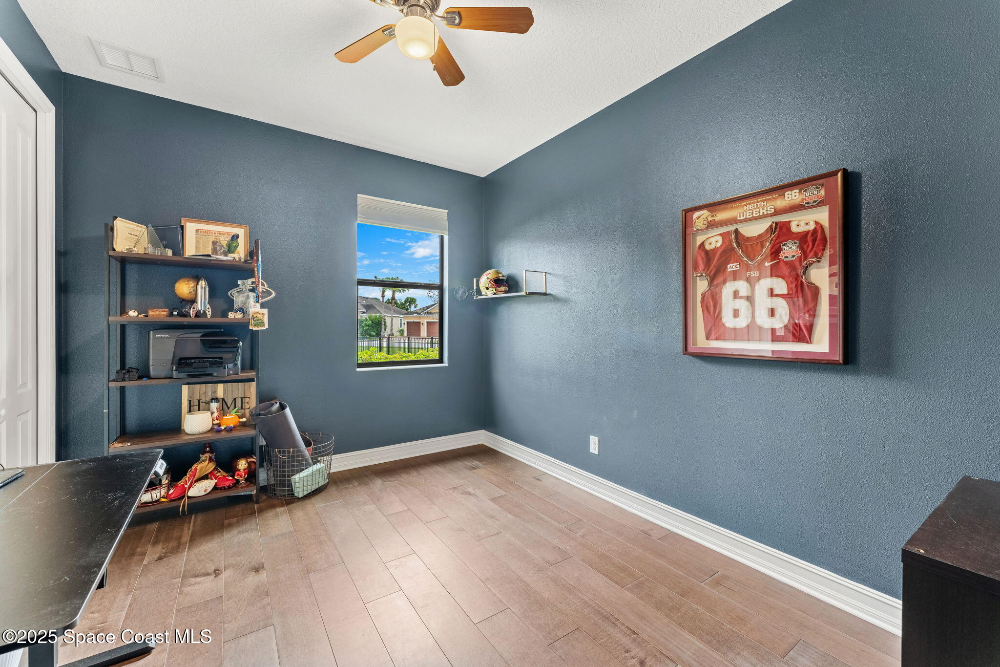 8545 Stalwart Circle Melbourne, FL 32940 - Photo 22 of 51 a view of room with toys and wooden floor