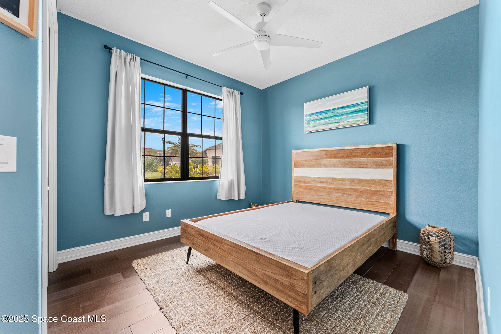 8545 Stalwart Circle Melbourne, FL 32940 - Photo 24 of 51 a bedroom with a bed and window