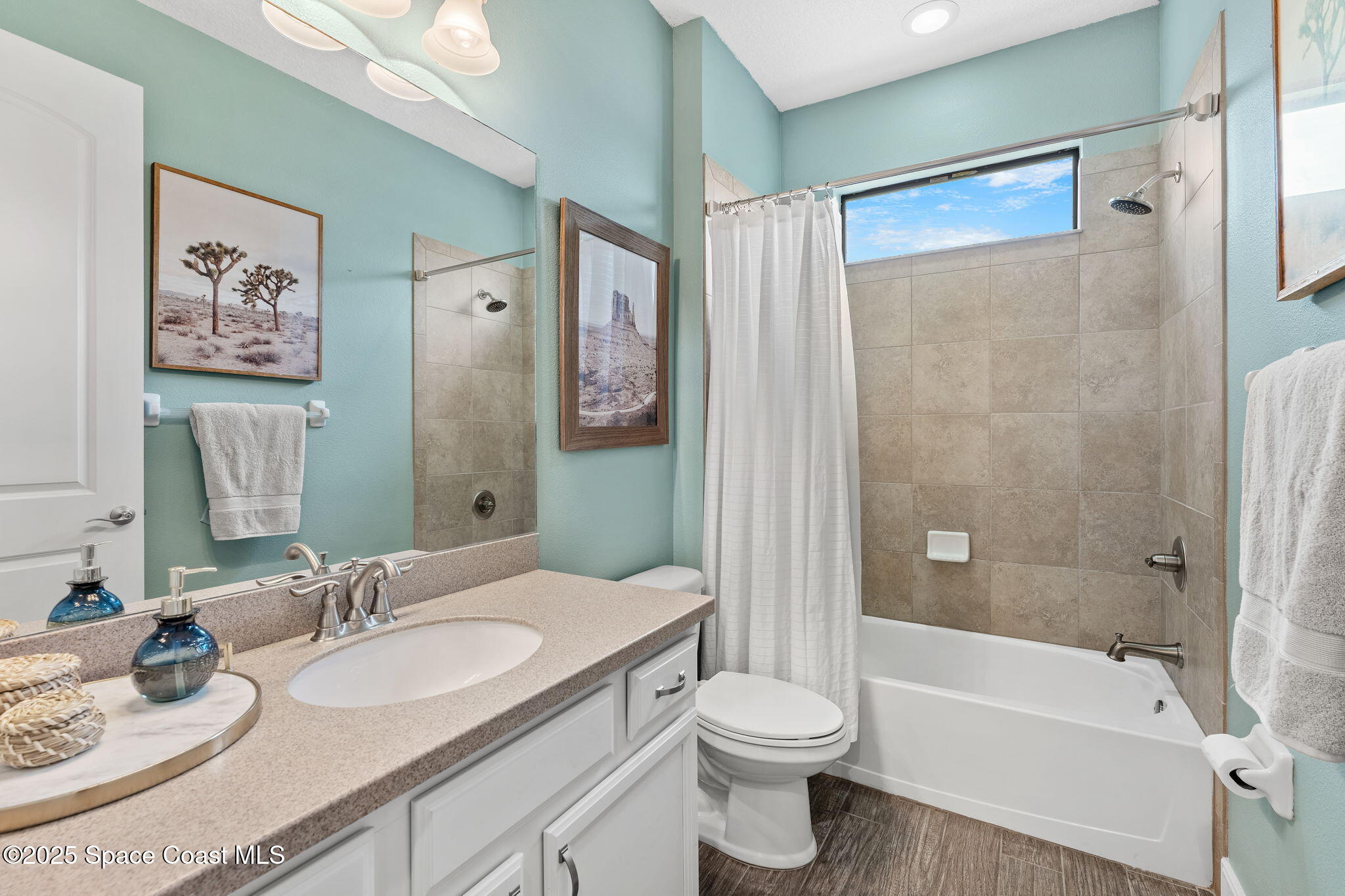 8545 Stalwart Circle Melbourne, FL 32940 - Photo 26 of 51 a bathroom with a granite countertop sink toilet and shower