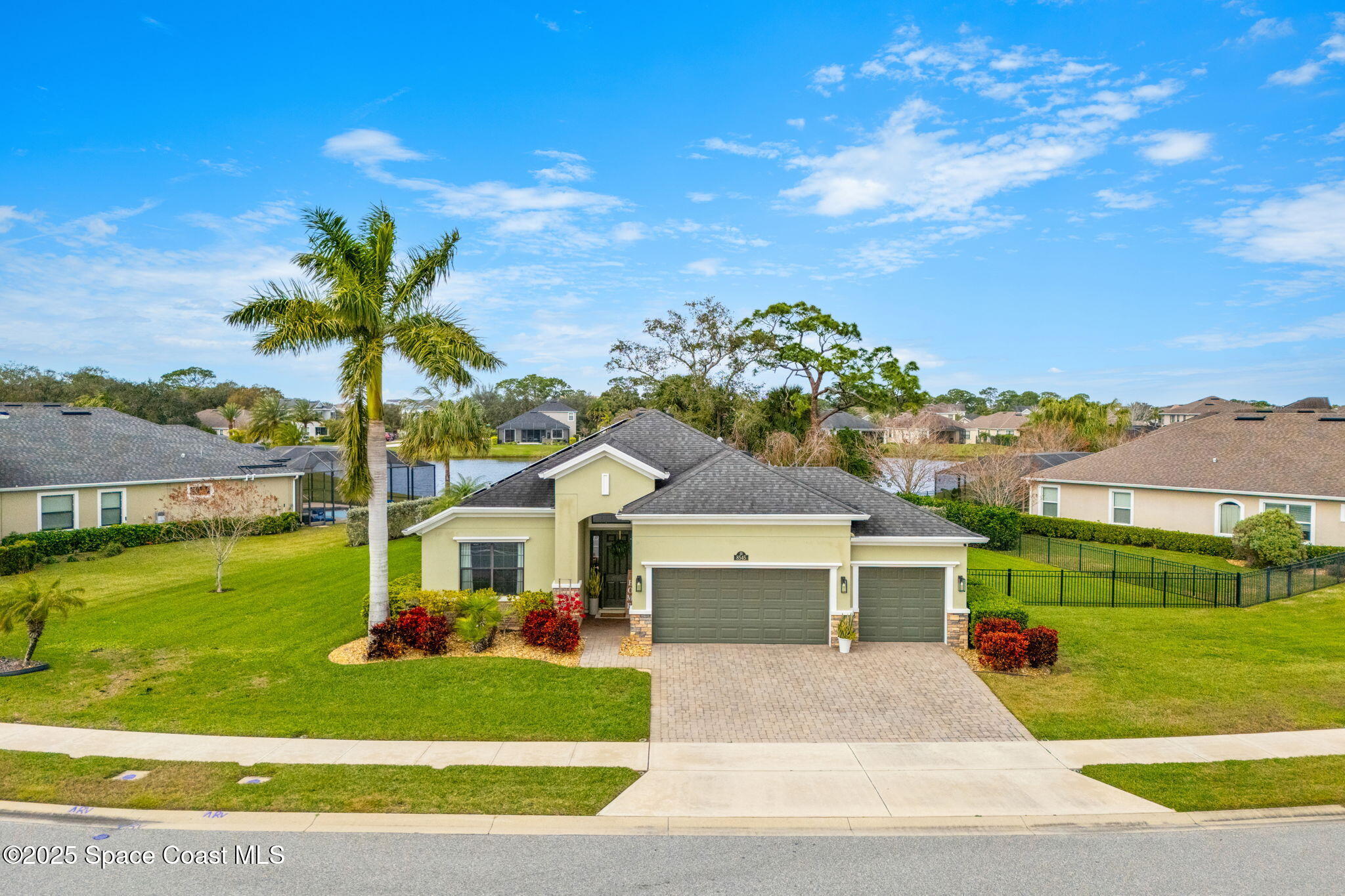 8545 Stalwart Circle Melbourne, FL 32940 - Photo 36 of 51 a front view of a house with a yard and garage
