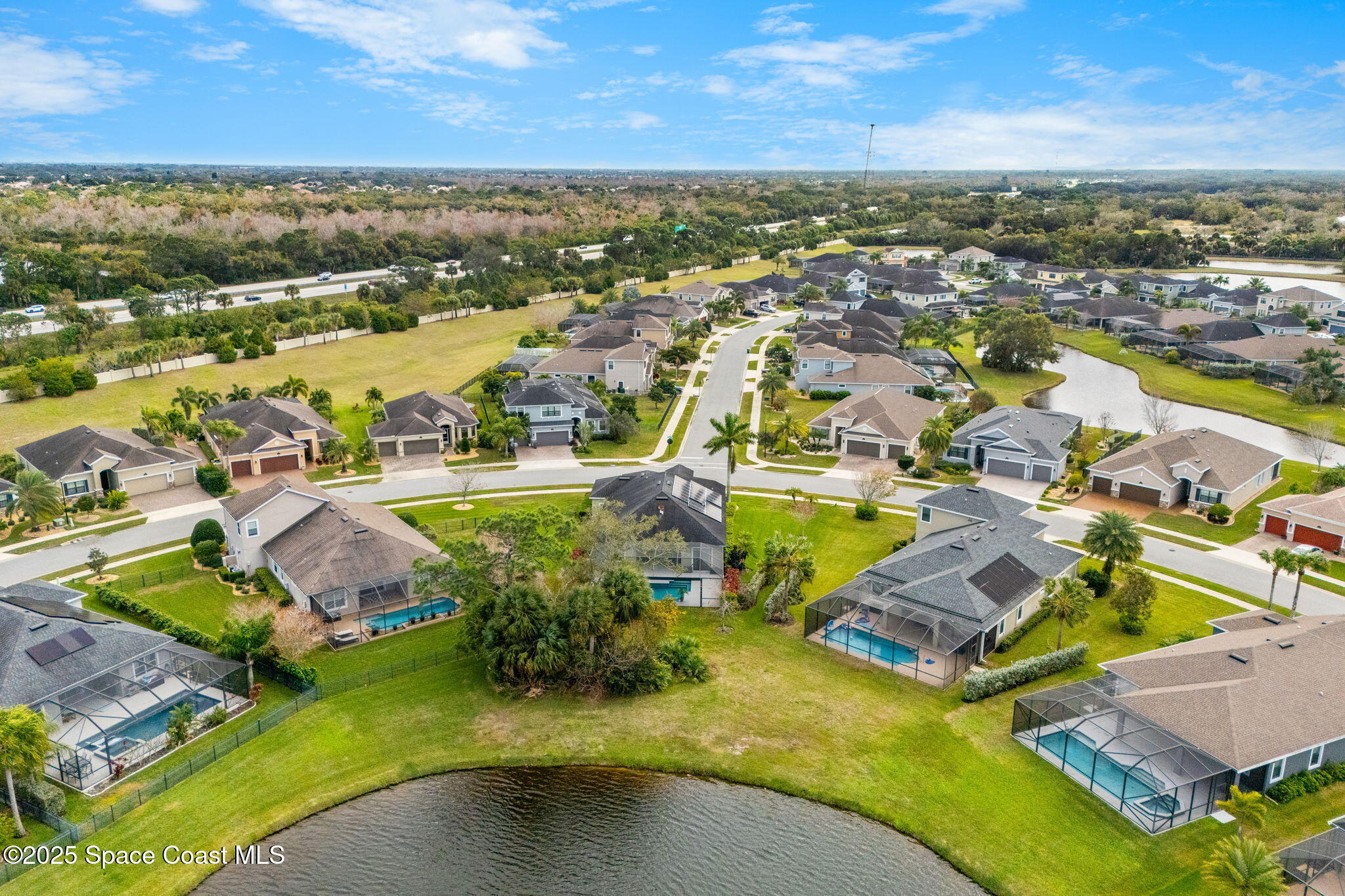 8545 Stalwart Circle Melbourne, FL 32940 - Photo 39 of 51 an aerial view of residential houses with outdoor space