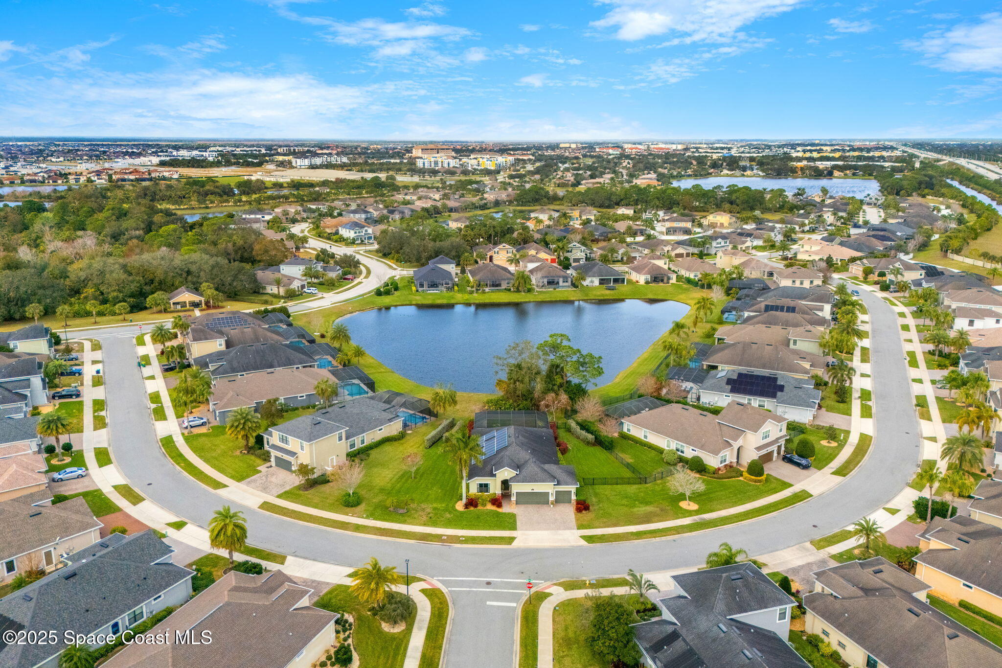 8545 Stalwart Circle Melbourne, FL 32940 - Photo 40 of 51 an aerial view of residential houses with outdoor space