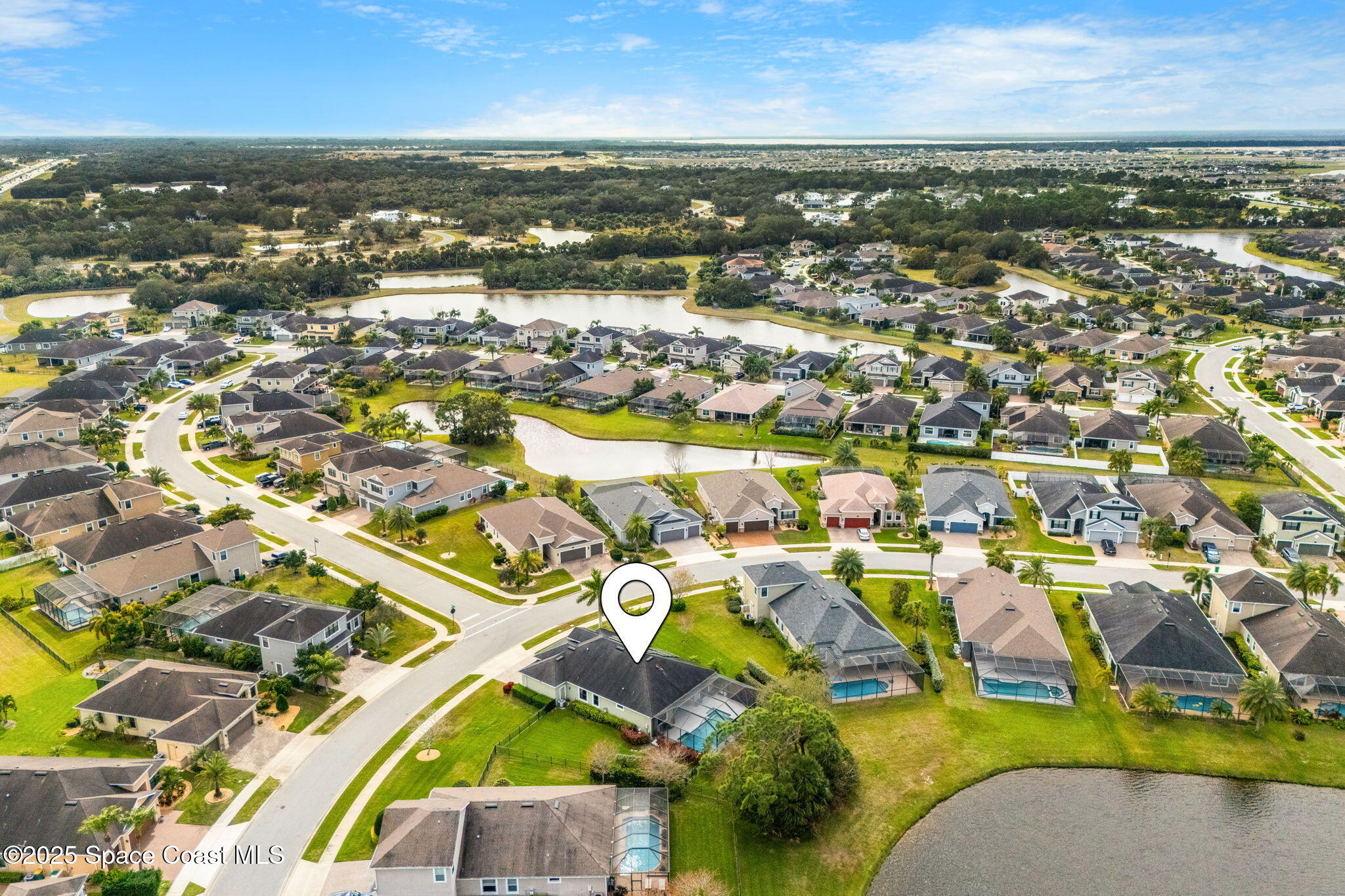8545 Stalwart Circle Melbourne, FL 32940 - Photo 42 of 51 an aerial view of residential houses with outdoor space