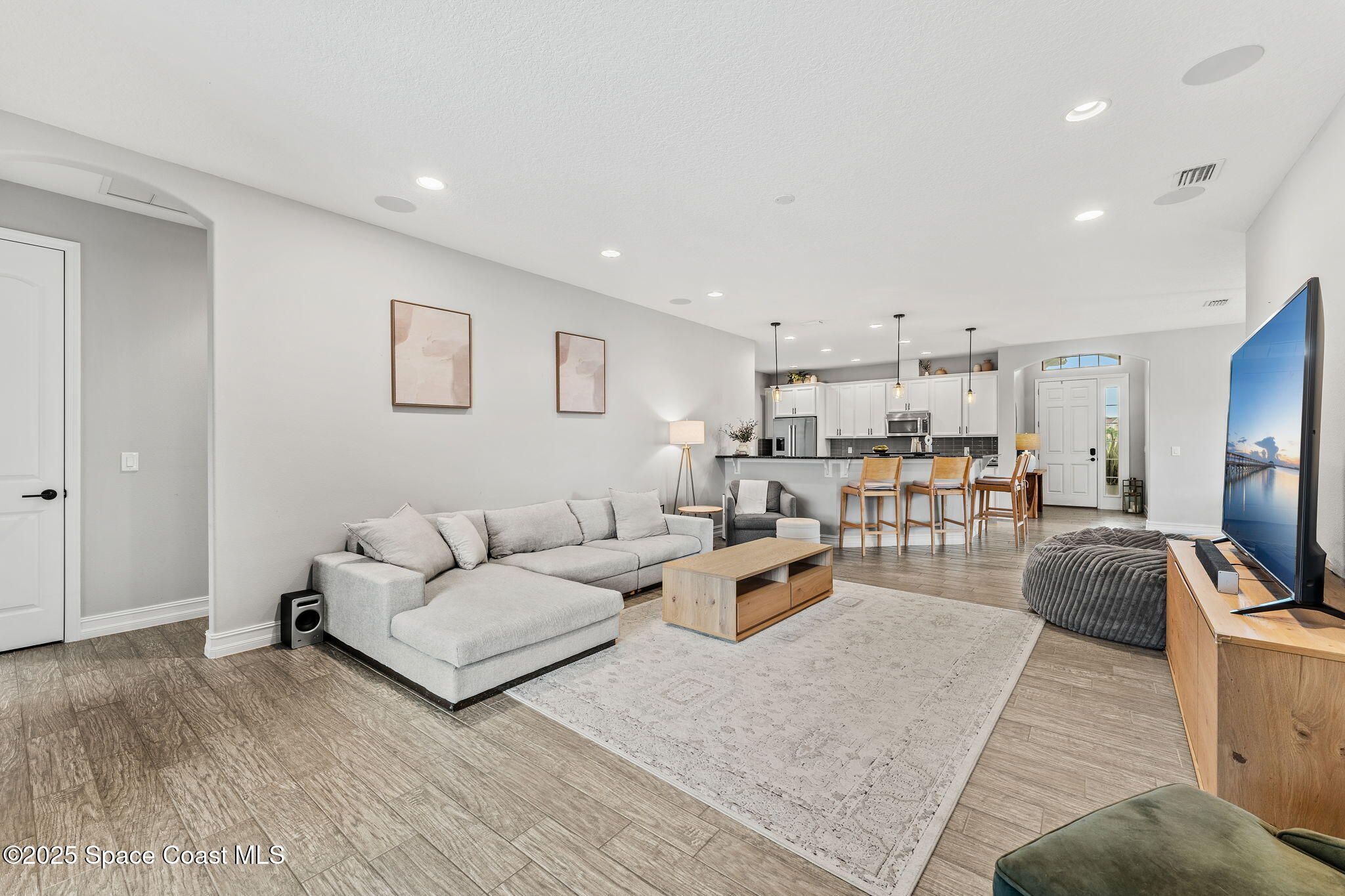 8545 Stalwart Circle Melbourne, FL 32940 - Photo 7 of 51 a living room with furniture and a flat screen tv