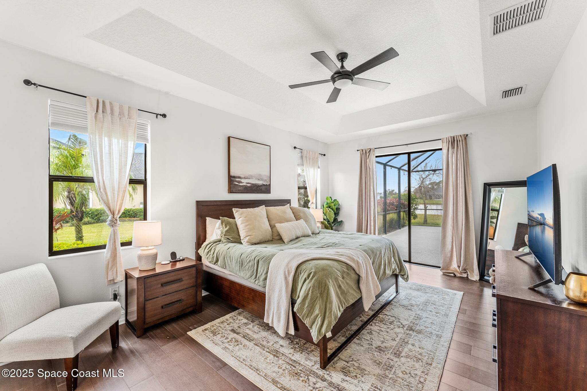 8545 Stalwart Circle Melbourne, FL 32940 - Photo 9 of 51 a bedroom with a bed and a couch