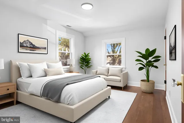 a bedroom with a large bed and a couch