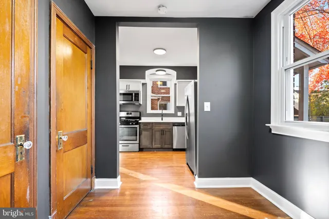 a view of a kitchen with a sink and a window