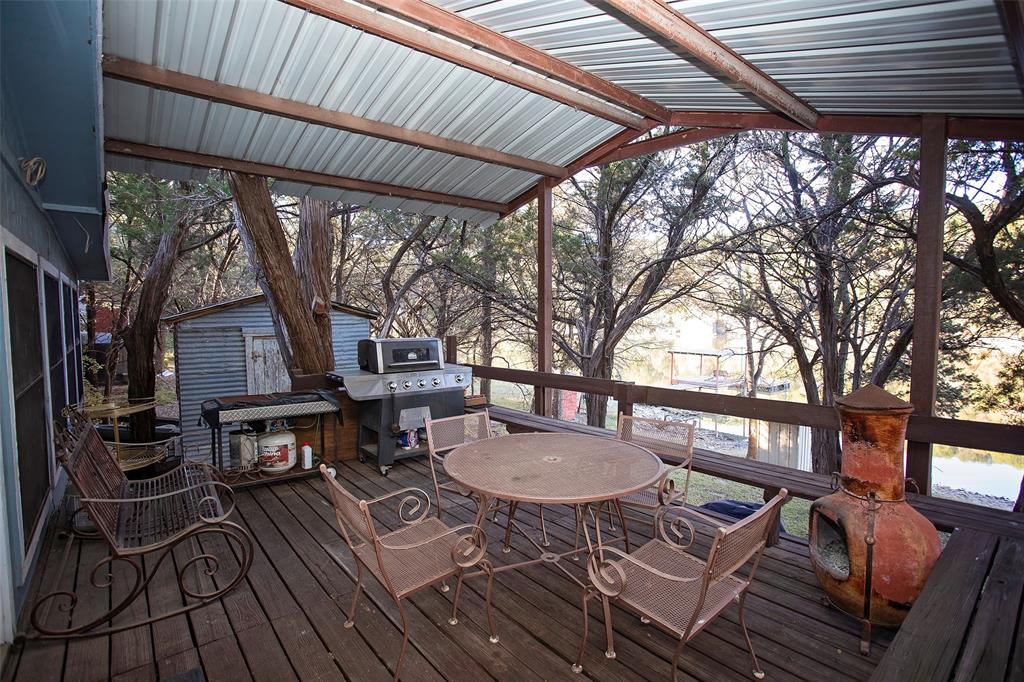 9051 Lacy Road Graford, TX 76449 - Photo 18 of 23 a table and chairs in a patio