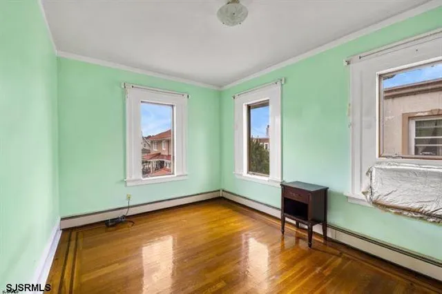 a view of room with lounge chair and windows