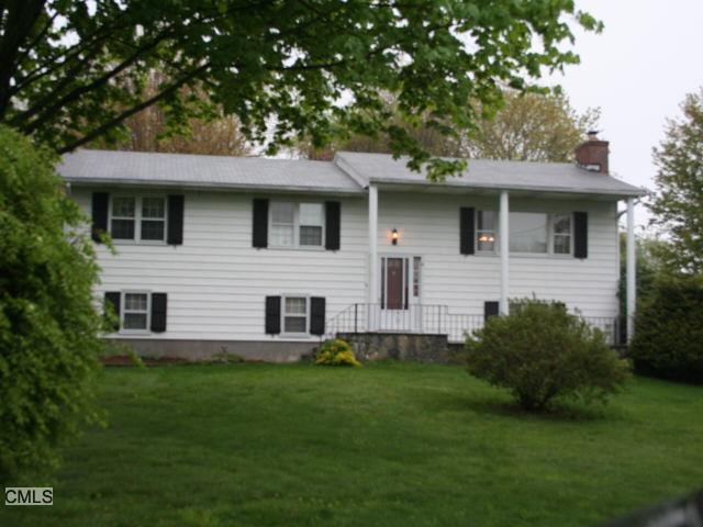 4 Davis Road Seymour, CT 06483 - Photo 1 of 1 a front view of a house with a garden