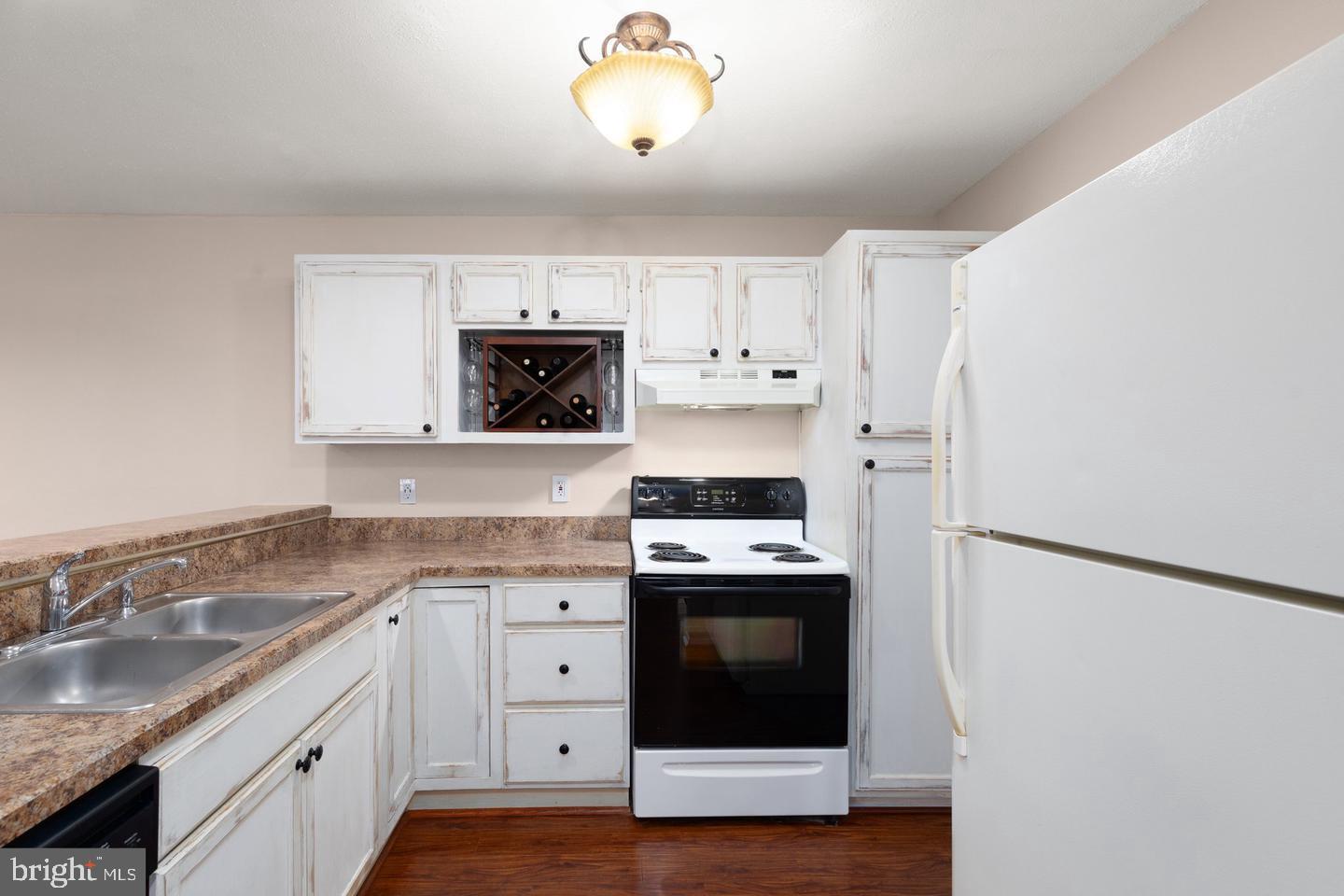308 G Canterbury Road, Unit 308G Bel Air, MD 21014 - Photo 3 of 25 a kitchen with cabinets stainless steel appliances and a counter space