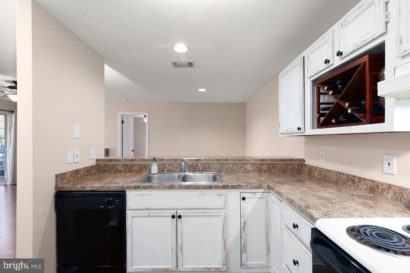 308 G Canterbury Road, Unit 308G Bel Air, MD 21014 - Photo 4 of 25 a kitchen with stainless steel appliances granite countertop a sink stove and cabinets