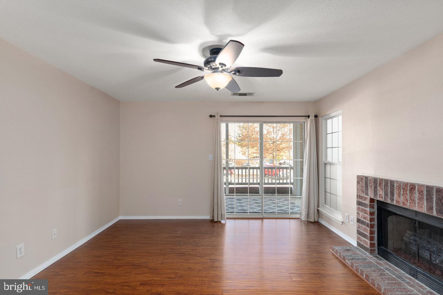 308 G Canterbury Road, Unit 308G Bel Air, MD 21014 - Photo 6 of 25 a view of an empty room with wooden floor and a window
