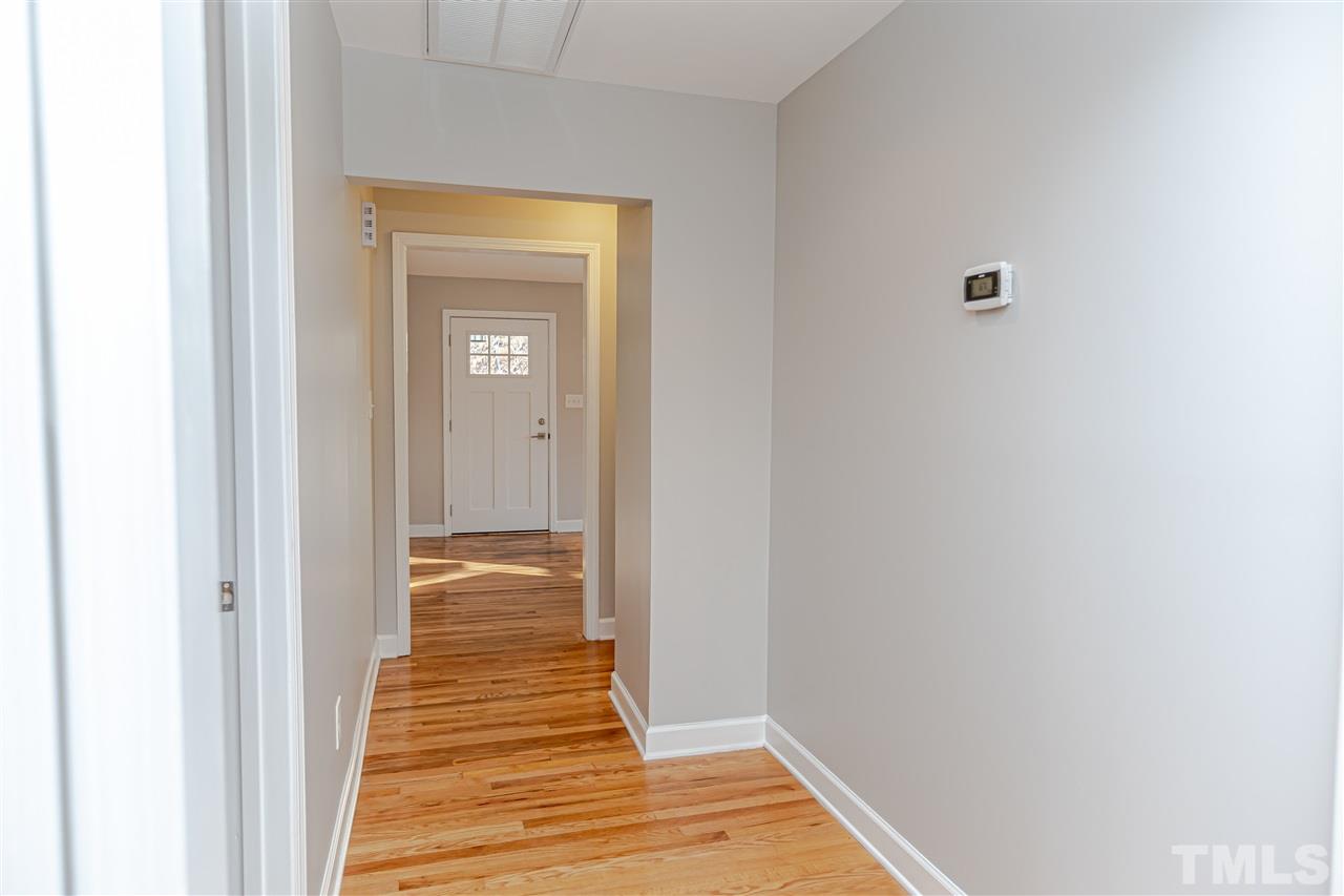 706 Hamilton Road Raleigh, NC 27604 - Photo 14 of 30 a view of a hallway with wooden floor