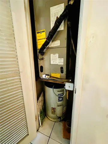 a view of a swimming pool with a patio and plants