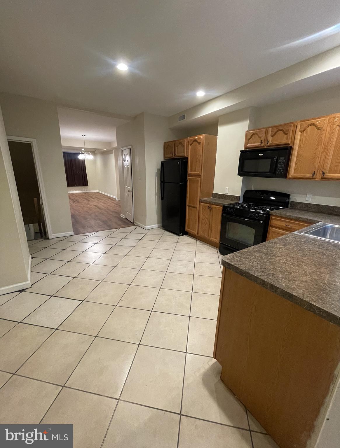 2786 The Alameda Baltimore, MD 21218 - Photo 6 of 17 a kitchen with stainless steel appliances a refrigerator sink and microwave
