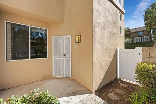 a view of a door with a potted plant