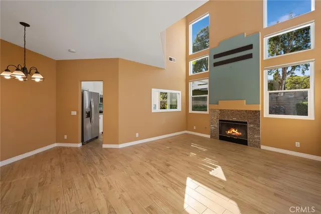 a view of livingroom with fireplace workspace and window