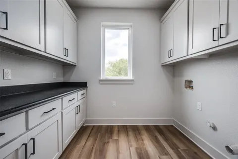 a bathroom with a granite countertop toilet a sink and a bathtub