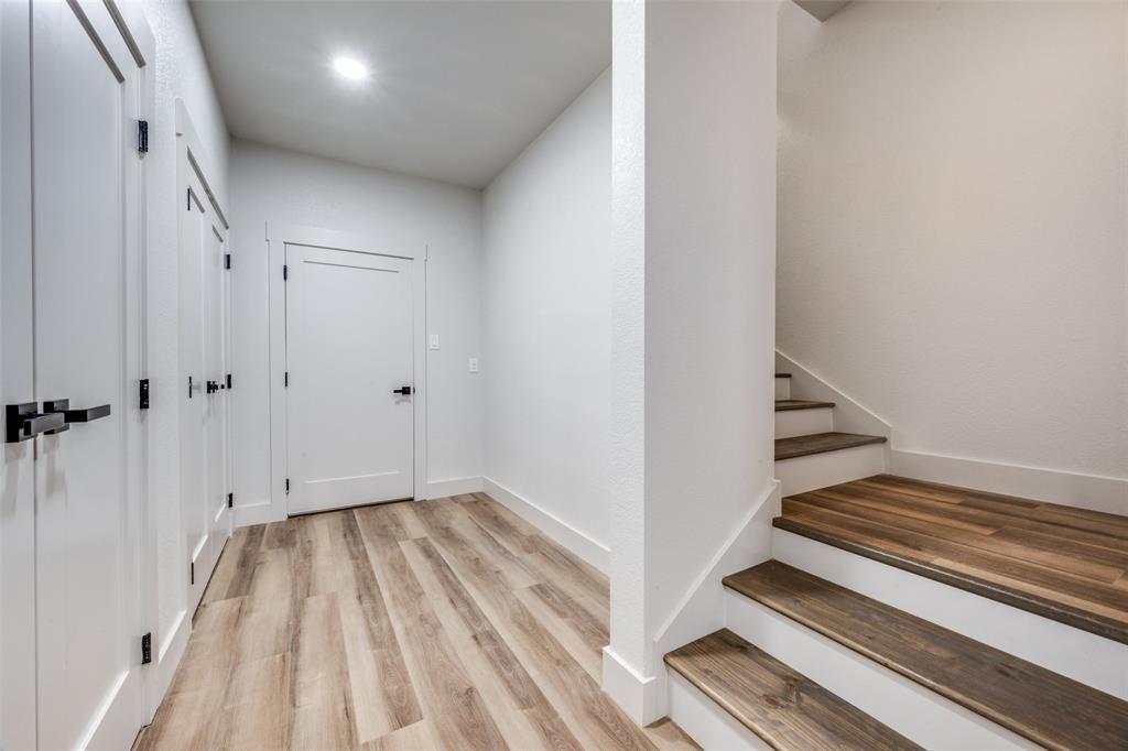 614 Twin Hills Road Lake Bridgeport, TX 76426 - Photo 20 of 25 a view of a room with wooden floor and white walls