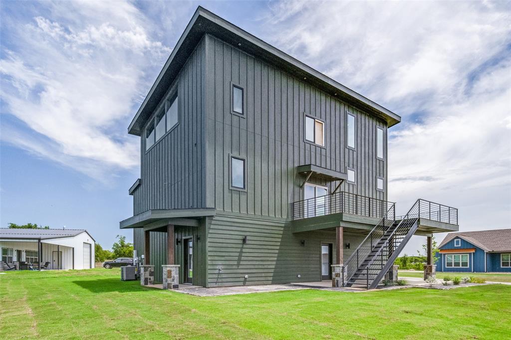 614 Twin Hills Road Lake Bridgeport, TX 76426 - Photo 25 of 25 a view of a house with a yard